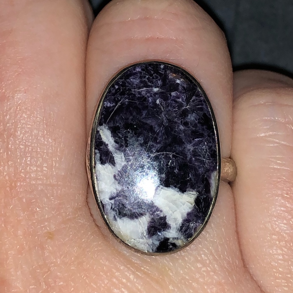 Sterling silver and genuine African lepidolite ring. Adjustable in size.